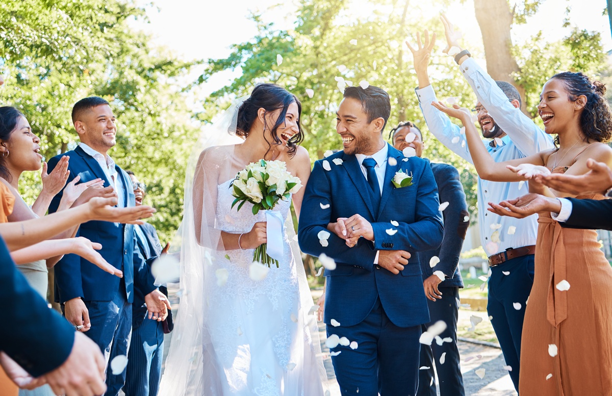 m_wedding-guests-throwing-rose-petals-confetti-tradi-2026-01-09-11-35-35-utc